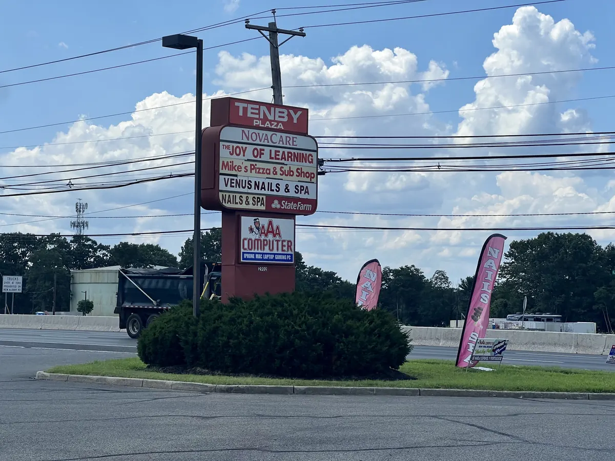 The Tenby Plaza sign on Route 130. We are on the AAA Computer panel.